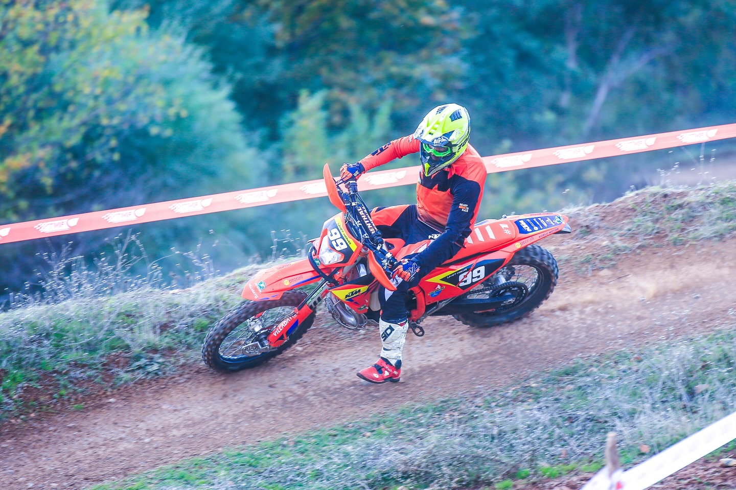 Enduro rider cornering on a race course