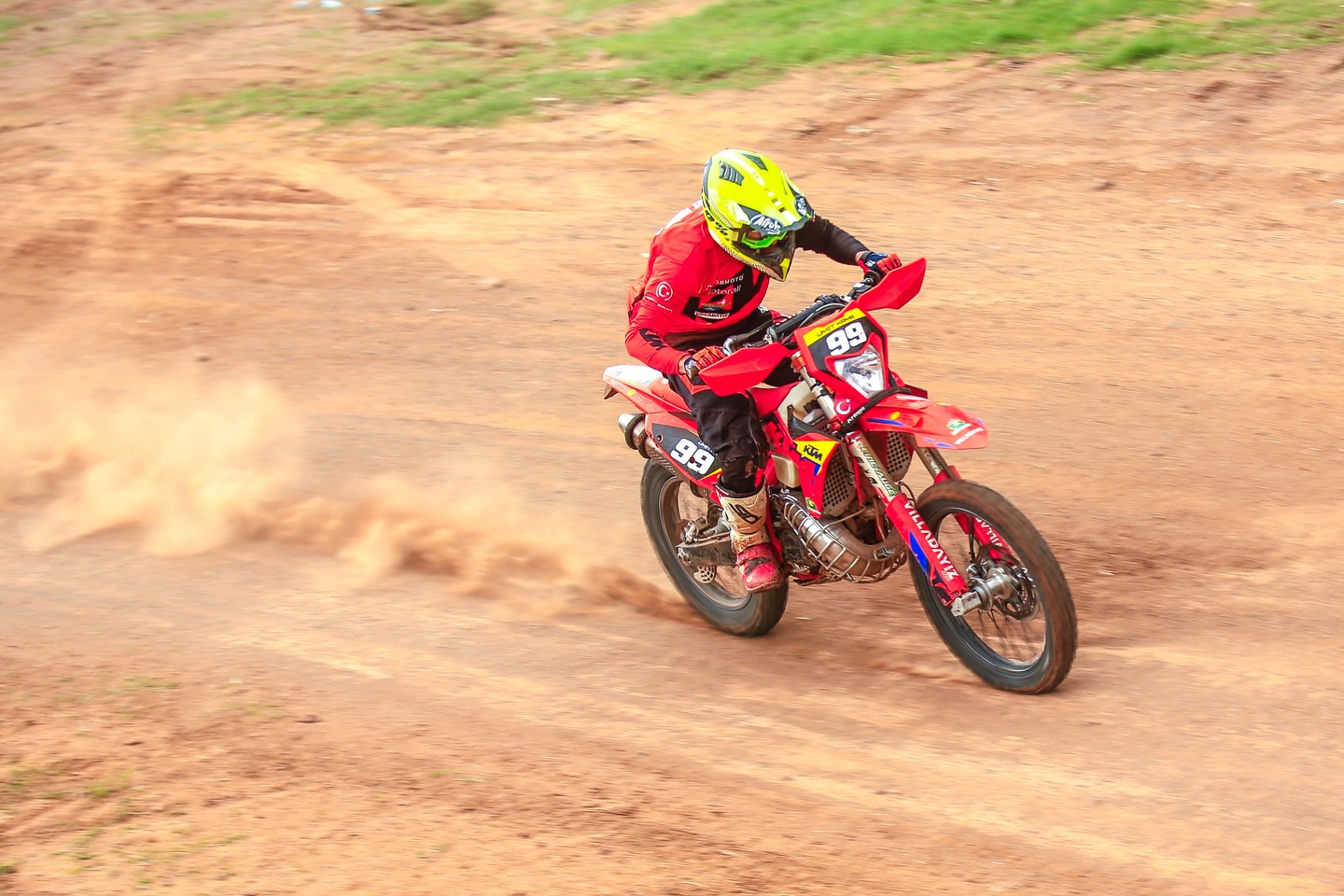 Enduro rider accelerating on dirt