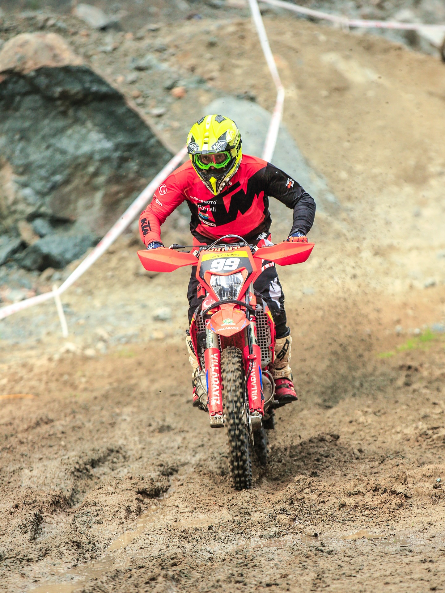 Enduro rider climbing a technical section
