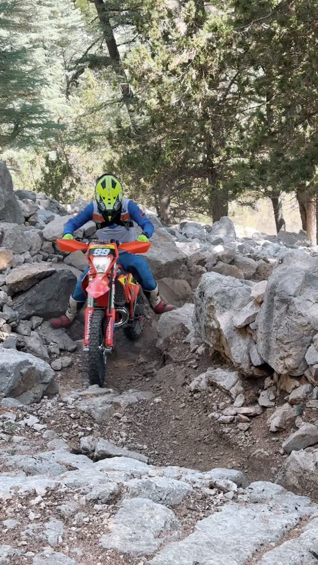 Enduro rider crossing a rock garden