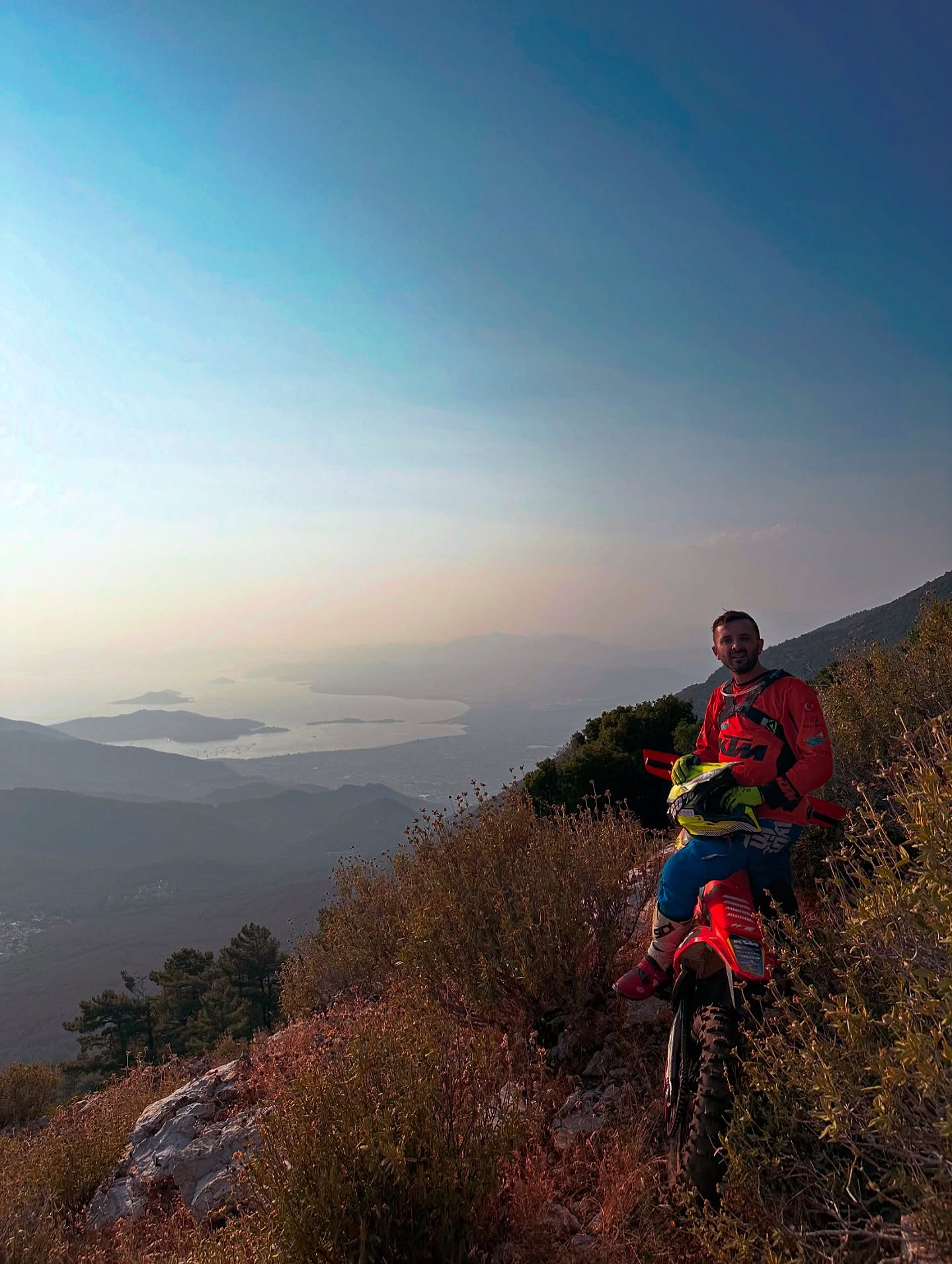 Enduro rider overlooking the Mediterranean coast